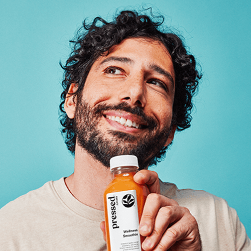 Person holding Wellness Smoothie